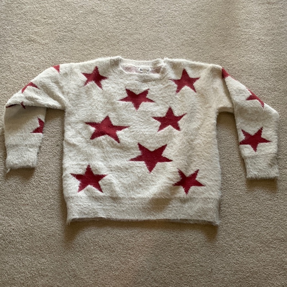 Boutique sweater w/ stars. Only worn once and in great condition.